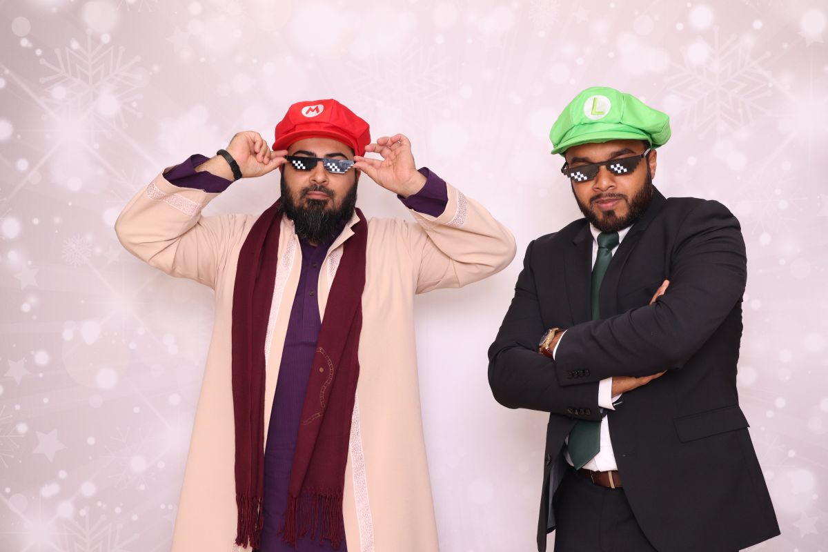 Guests having fun with photo booth props